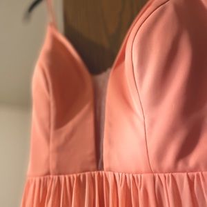 Beautiful pale pink bridesmaid dress! It has a slight stretch material.